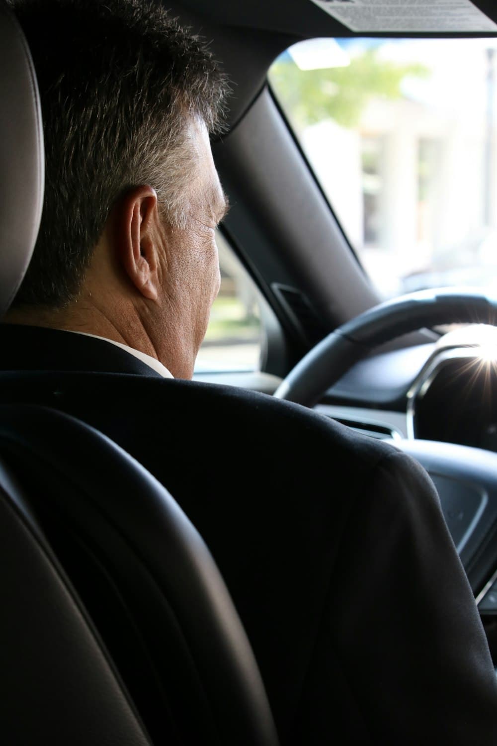 ME CABS chauffeur on-duty, seen from the back seat