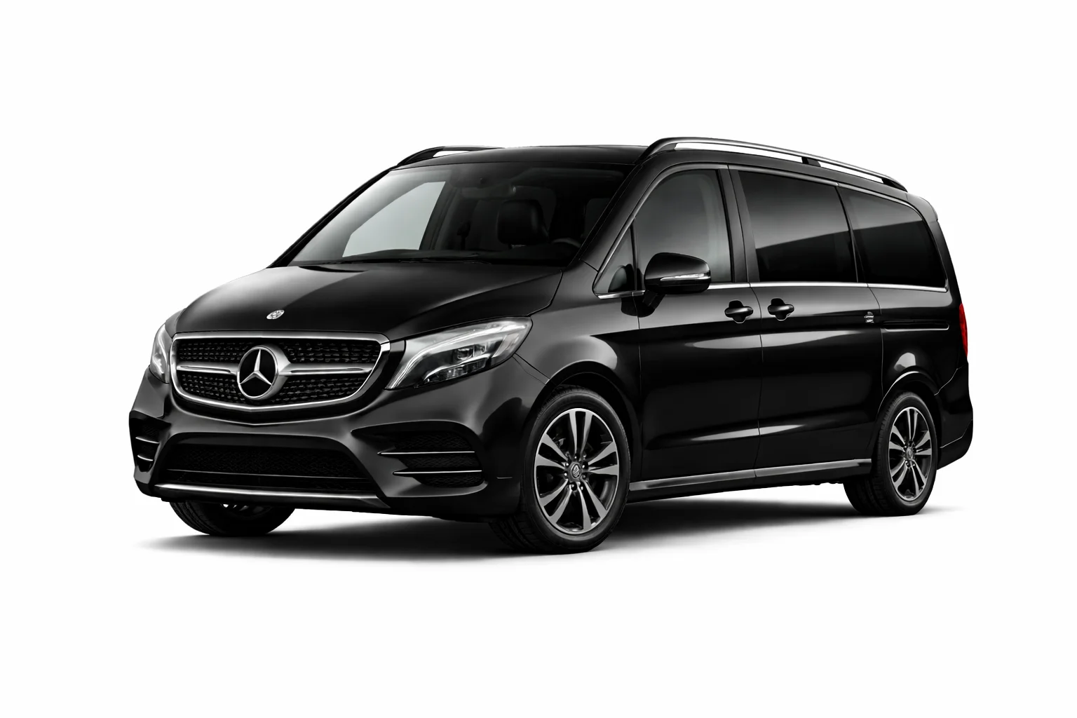 Mercedes V-Class or Kia Carnival with luggage loaded.
